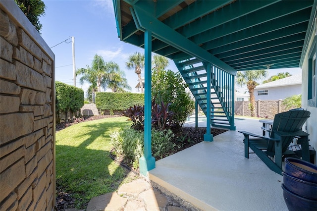 exterior space featuring stairs and fence