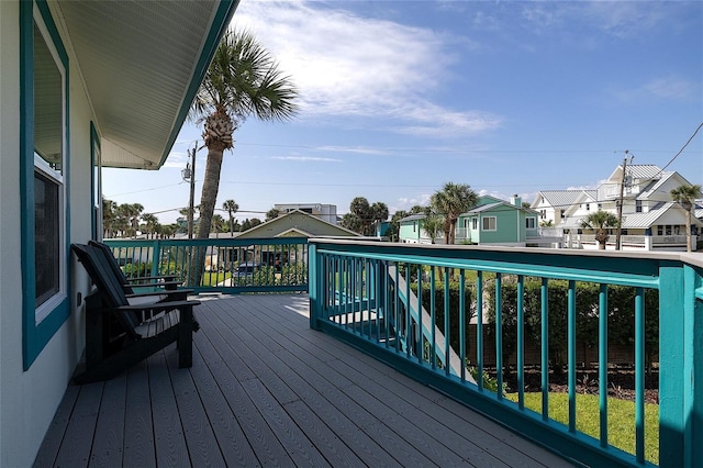 wooden terrace featuring a residential view