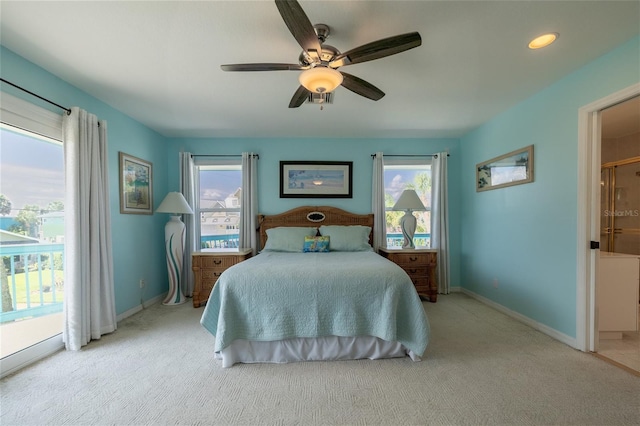 bedroom featuring carpet floors, access to outside, and multiple windows