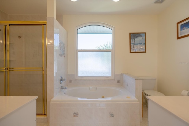 bathroom featuring a garden tub, toilet, visible vents, vanity, and a stall shower