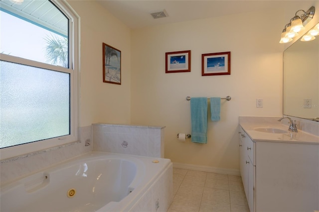 full bath with visible vents, baseboards, a whirlpool tub, tile patterned flooring, and vanity