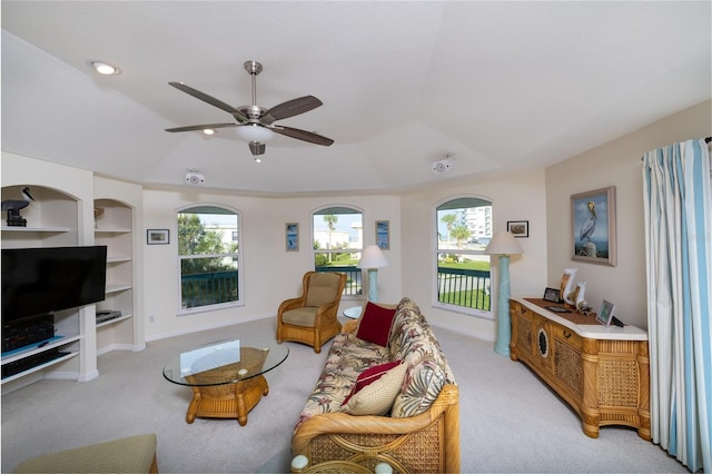 living room featuring built in features, baseboards, light colored carpet, ceiling fan, and recessed lighting