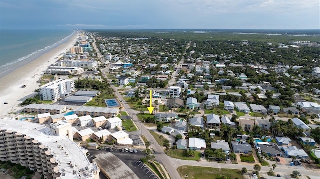 birds eye view of property with a view of the beach and a water view