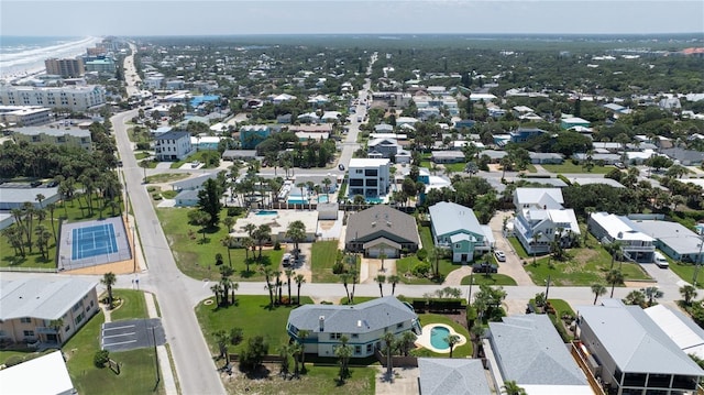 drone / aerial view with a water view and a residential view