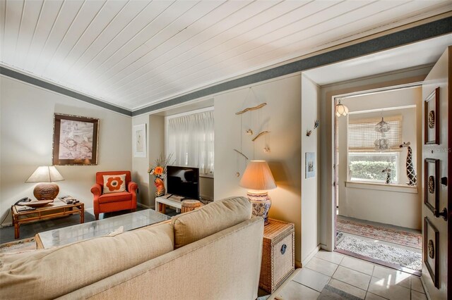 living room featuring crown molding, wood ceiling, and light tile patterned floors