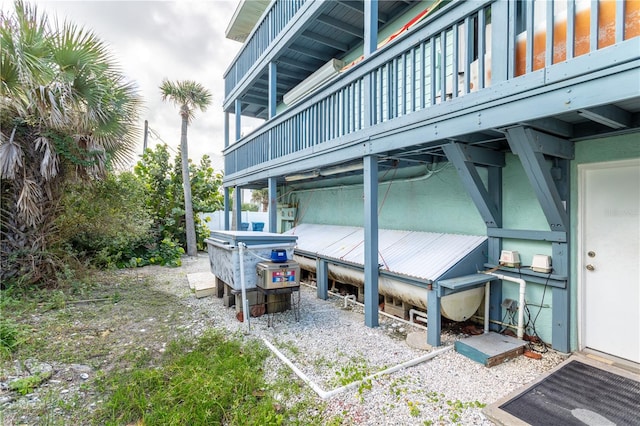 view of side of home with a wooden deck