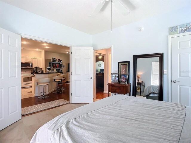 bedroom with light tile patterned flooring and ceiling fan