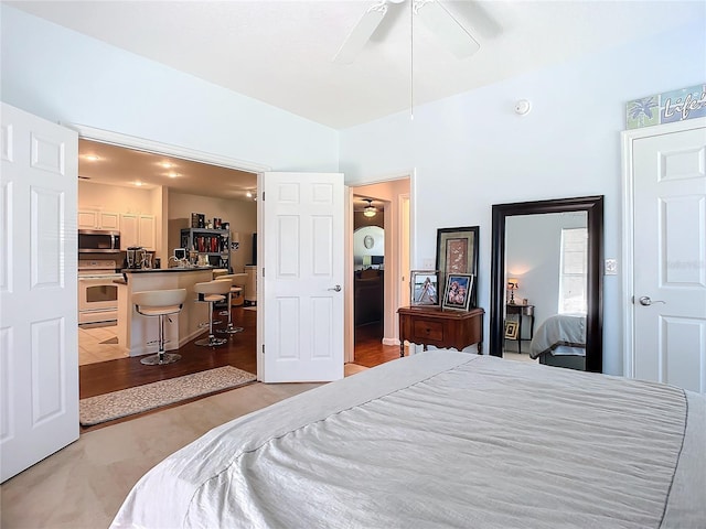 bedroom with lofted ceiling and a ceiling fan