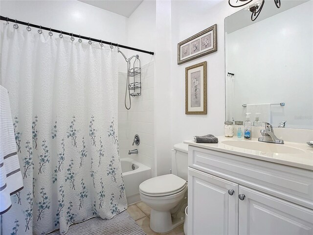 full bathroom featuring toilet, vanity, shower / tub combo, and tile patterned floors