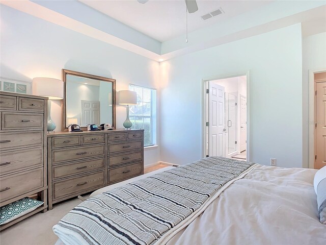 bedroom featuring light colored carpet and ceiling fan