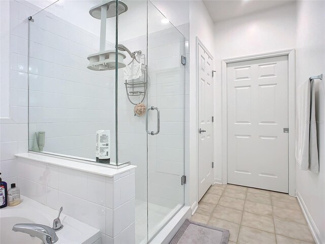 bathroom featuring tile patterned flooring and walk in shower