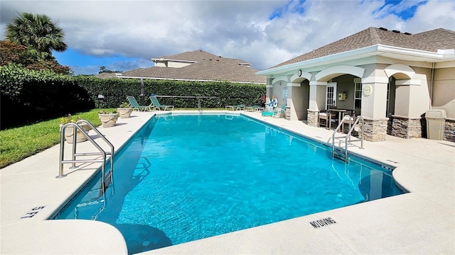 pool featuring a patio area