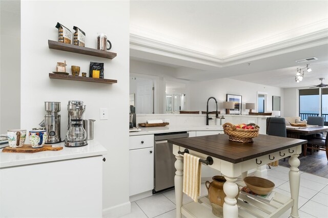 kitchen with visible vents, crown molding, stainless steel dishwasher, white cabinets, and open shelves