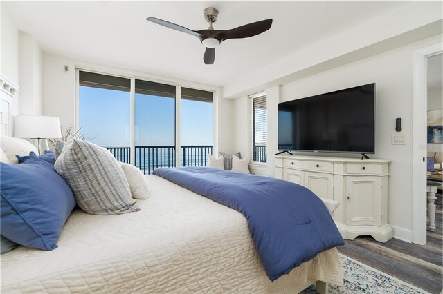 bedroom with access to exterior, wood finished floors, baseboards, and ceiling fan