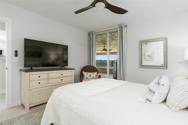 bedroom with access to exterior, a ceiling fan, baseboards, and light carpet