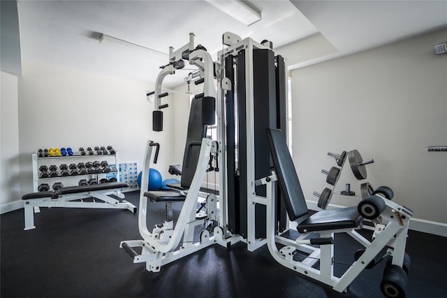 gym featuring baseboards