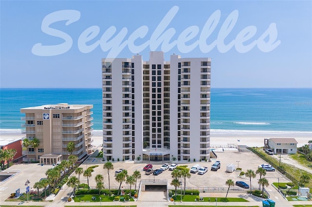 exterior space featuring a view of the beach and a water view