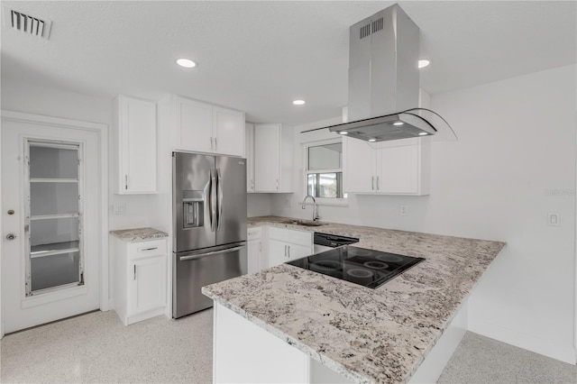 kitchen with appliances with stainless steel finishes, light stone counters, white cabinetry, kitchen peninsula, and island exhaust hood