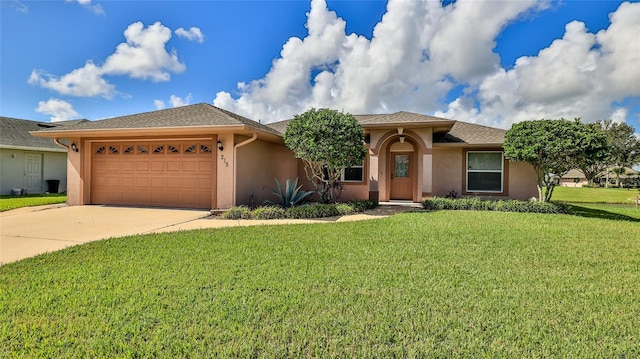 view of front of property with a garage and a front yard