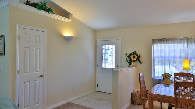 view of carpeted foyer