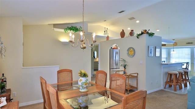 carpeted dining space featuring vaulted ceiling and an inviting chandelier