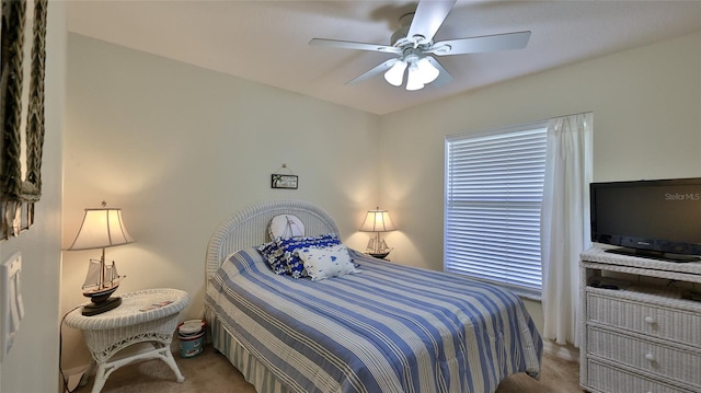 bedroom featuring ceiling fan and light colored carpet