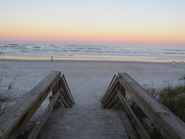 view of community with a view of the beach and a water view