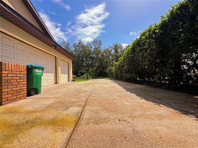 1780 Otisco Way, Winter Springs, FL 32708 - view of yard with a garage and concrete driveway