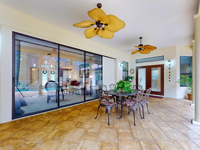 dining room with ceiling fan and french doors