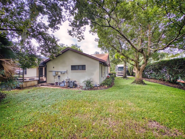 1780 Otisco Way, Winter Springs, FL 32708 - back of property featuring stucco siding and a lawn