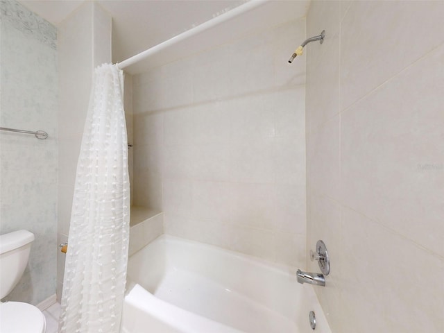 bathroom with shower / bath combination with curtain and toilet