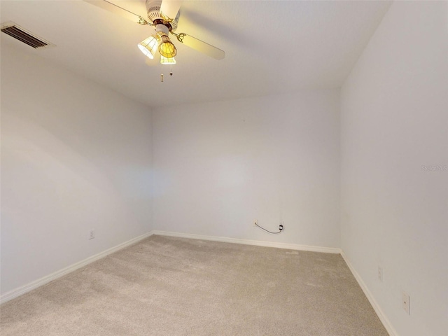 unfurnished room featuring light carpet and ceiling fan