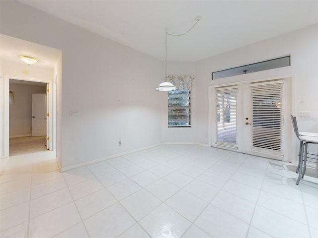 unfurnished dining area featuring light tile patterned floors