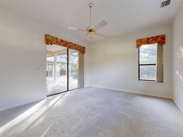 carpeted empty room with ceiling fan