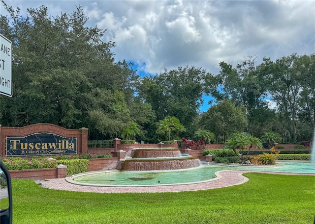 view of community featuring a yard