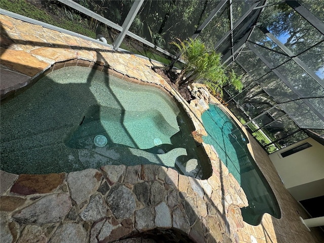 view of pool featuring a hot tub