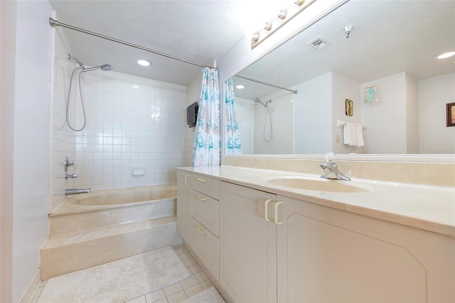 bathroom with tile patterned flooring, shower / bath combination with curtain, and vanity