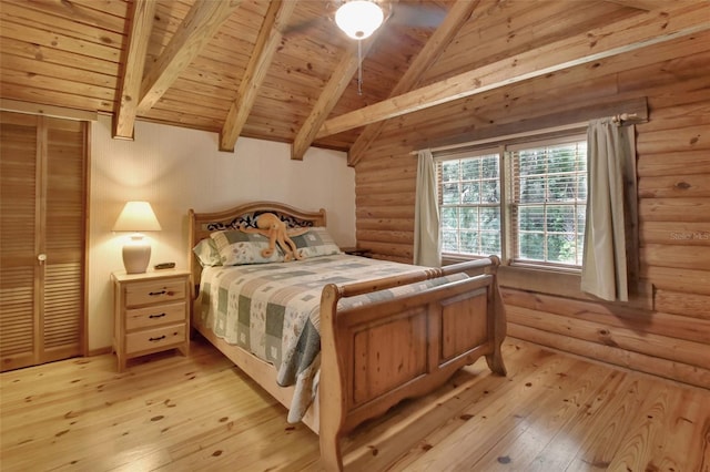 bedroom with wood ceiling, rustic walls, vaulted ceiling with beams, and light wood-style flooring