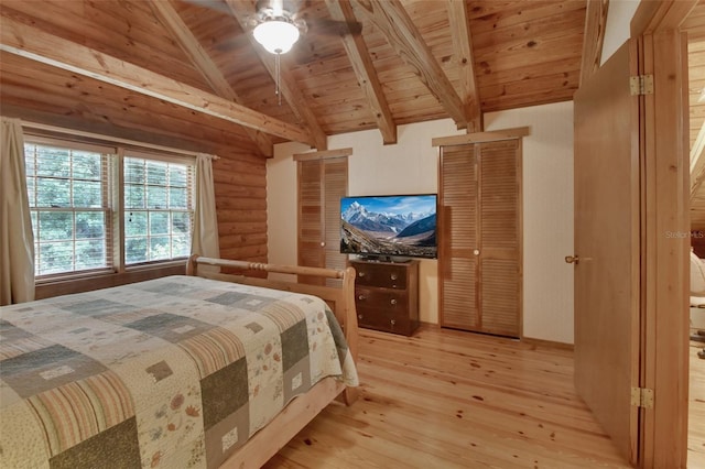 bedroom featuring vaulted ceiling with beams, light wood-style floors, wood ceiling, and log walls