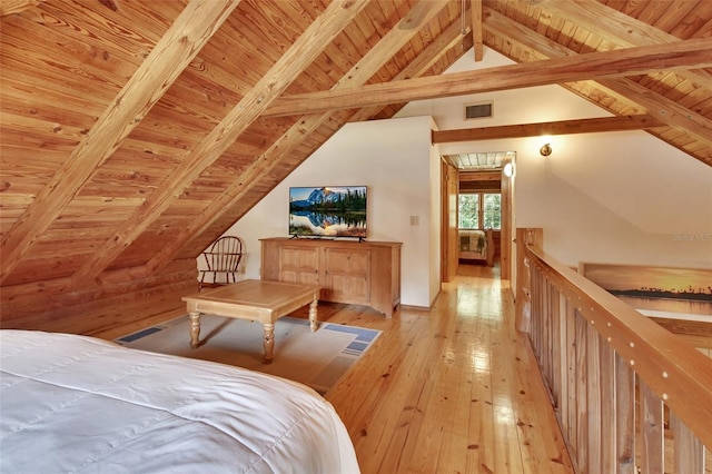 bedroom with wood ceiling, lofted ceiling with beams, light wood-type flooring, and visible vents