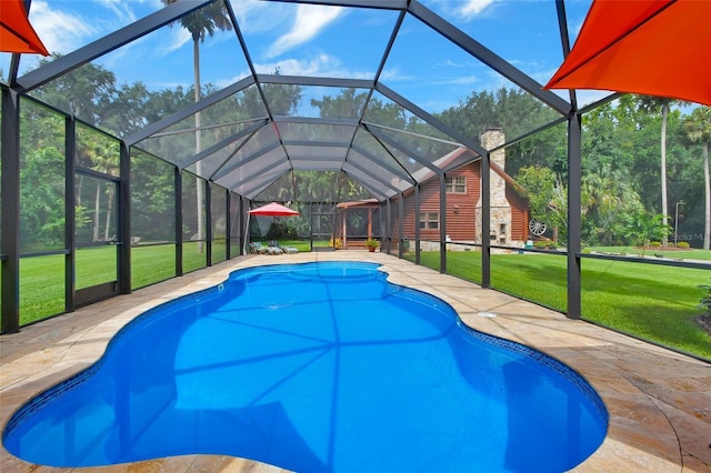 outdoor pool with a lanai, a lawn, and a patio