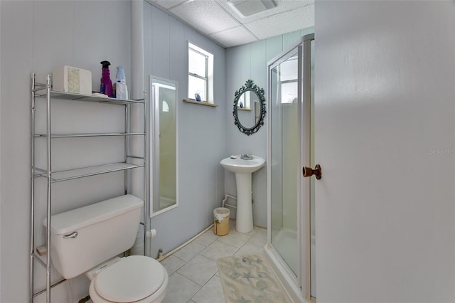 full bath with a paneled ceiling, visible vents, toilet, a shower stall, and tile patterned floors