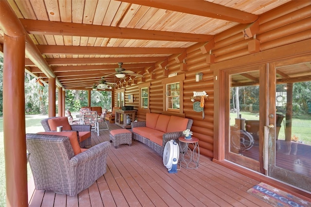 deck featuring outdoor lounge area and a ceiling fan