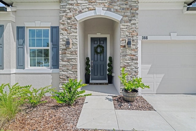 doorway to property featuring a garage