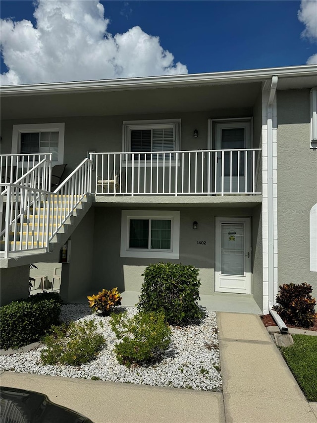 view of front of home with a balcony