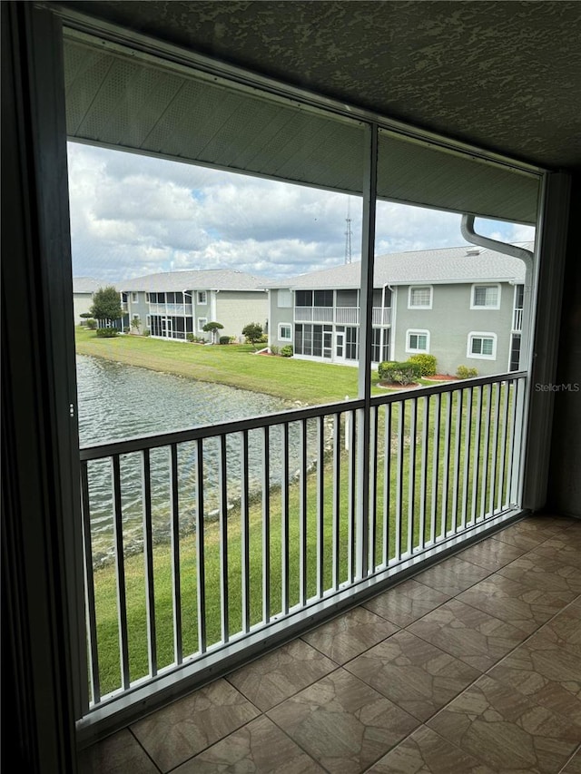 balcony featuring a water view