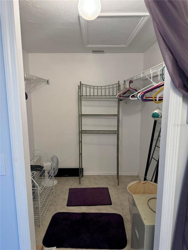 walk in closet featuring light tile patterned floors