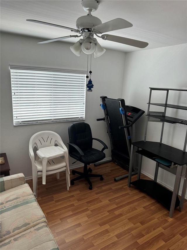 bedroom with ceiling fan and hardwood / wood-style floors