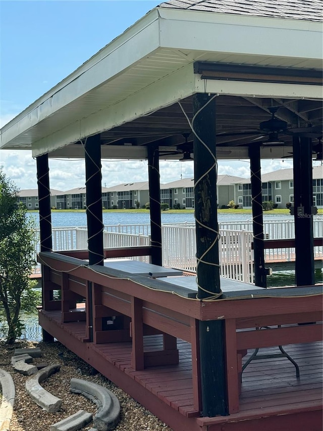 view of dock with a gazebo and a water view