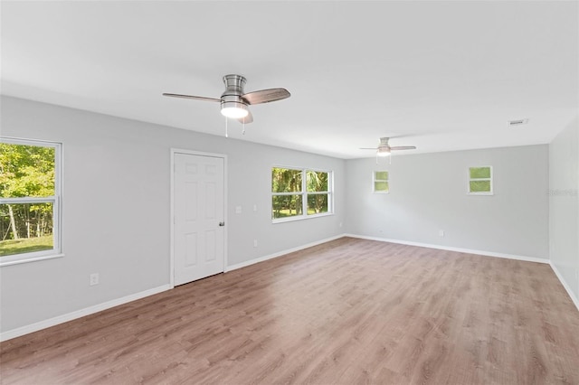 spare room featuring ceiling fan and light hardwood / wood-style floors